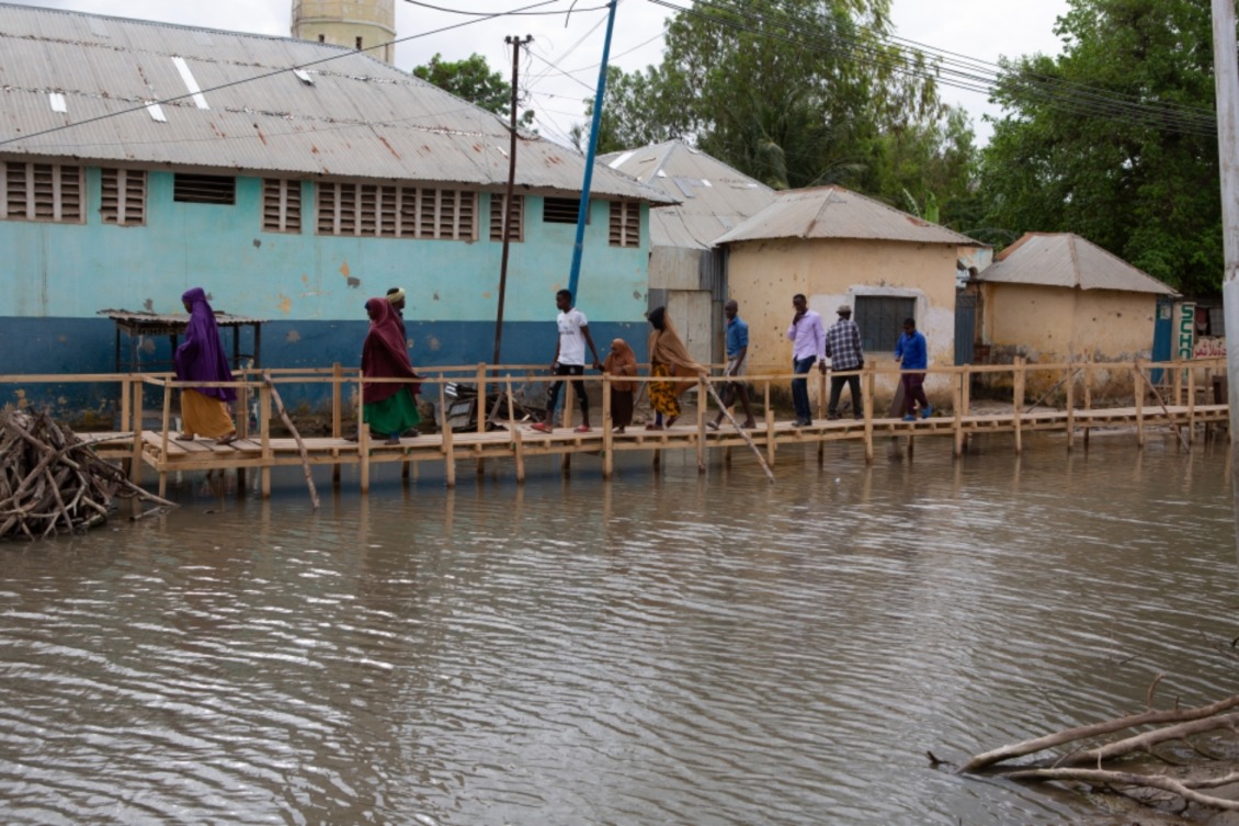 With the normal routes to the market washed out, residents use this wooden bridge to travel back and forth.