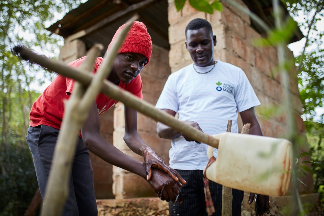 Action Against Hunger teams carry out sensitization activities with families to teach about good hygiene and encourage use of latrines.