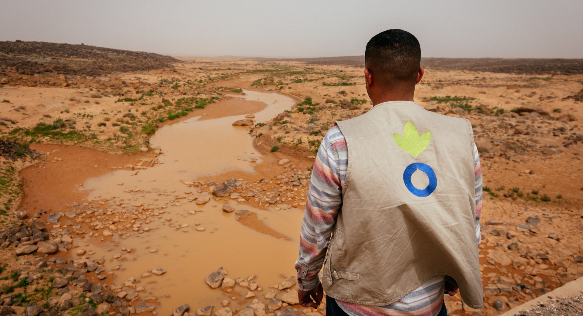 Wasfi Al Sarhan, Action Against Hunger project manager, looks out over an arid landscape in Jordan.