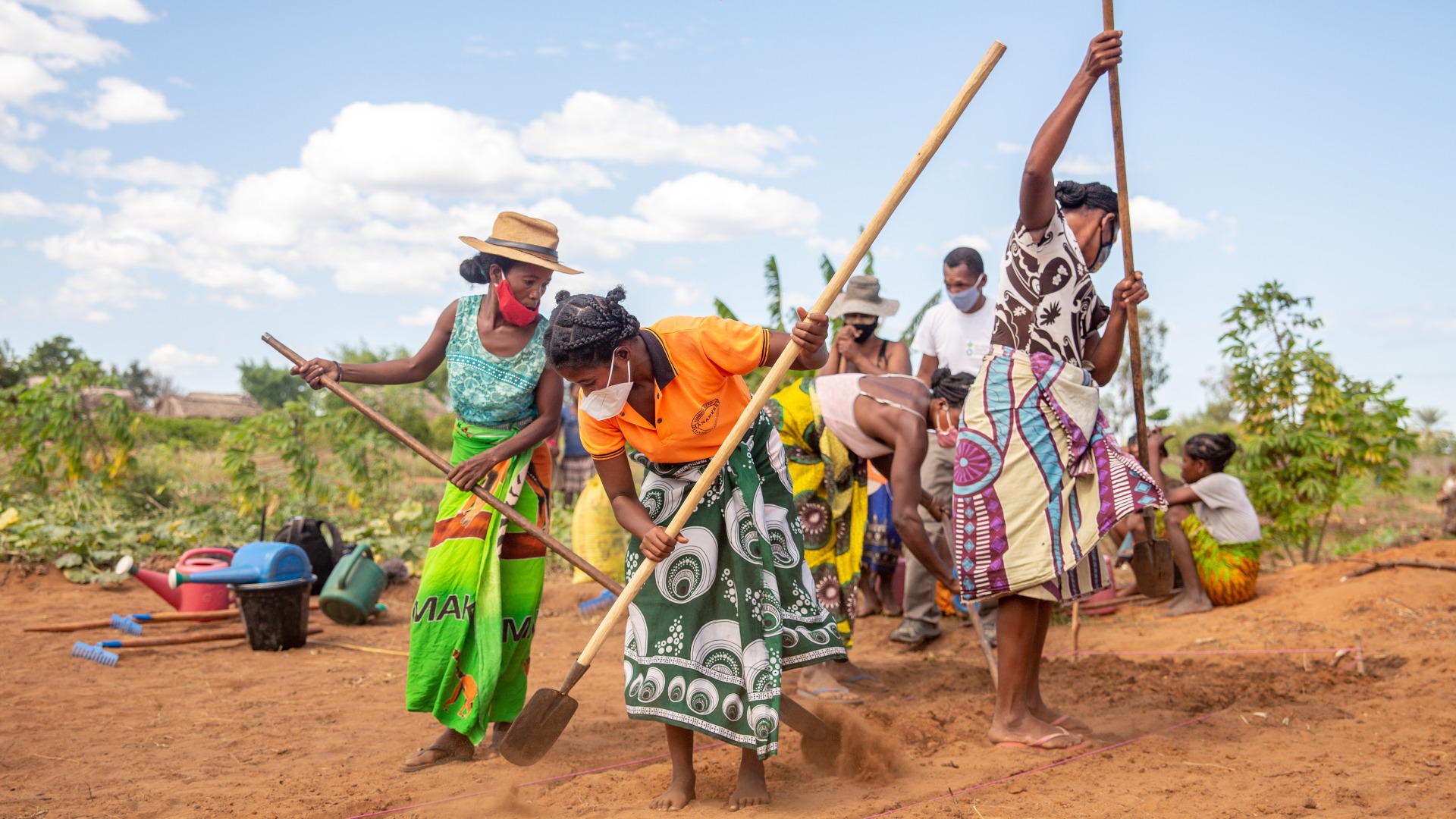 Farmers work in parched fields. Action Against Hunger works to support agricultural projects, but more support is needed as drought and sandstorms continue to wreak havoc on planting and harvest seasons.