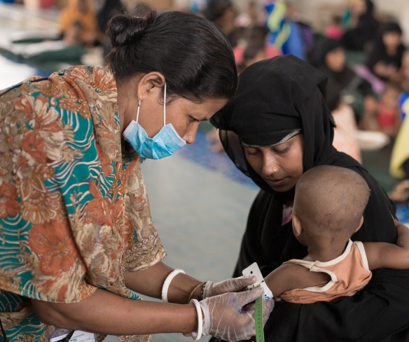 A child is measured for malnutrition at one of Action Against Hunger's nutrition centers in Cox's Bazar.