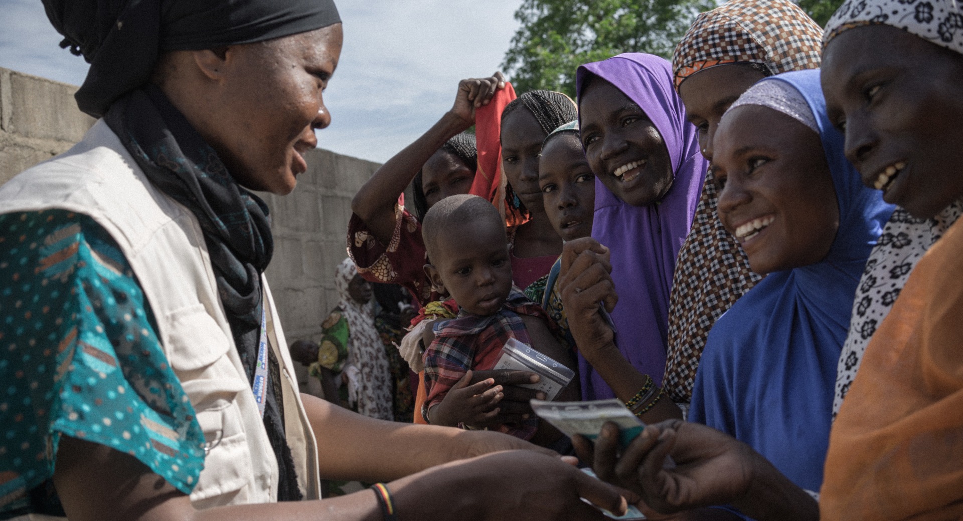 Action Against Hunger staff conduct a distribution of hundreds of shelter kits and hygiene kits to displaced people in Monguno, Borno State, Nigeria