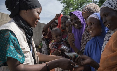 Action Against Hunger staff conduct a distribution of hundreds of shelter kits and hygiene kits to displaced people in Monguno, Borno State, Nigeria