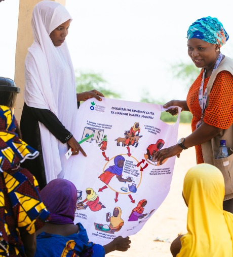 Action Against Hunger staff host a hygiene education session for displaced families in Nigeria.