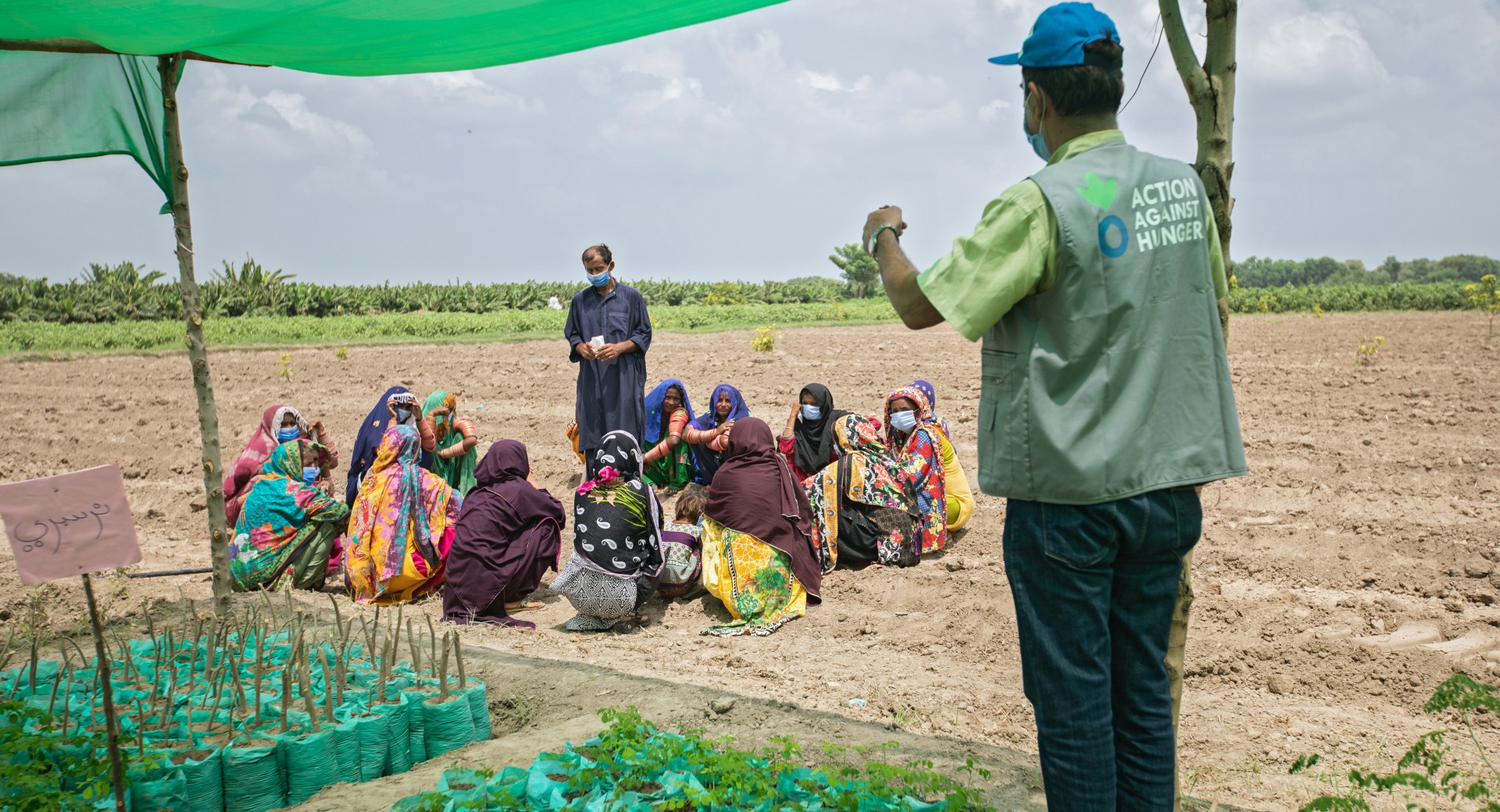 Ashraf Qasqariya, a trainer at the Farmer Field School (FFS), conducts a Community Mobilization Session on Kitchen Gardening in Jamot Village