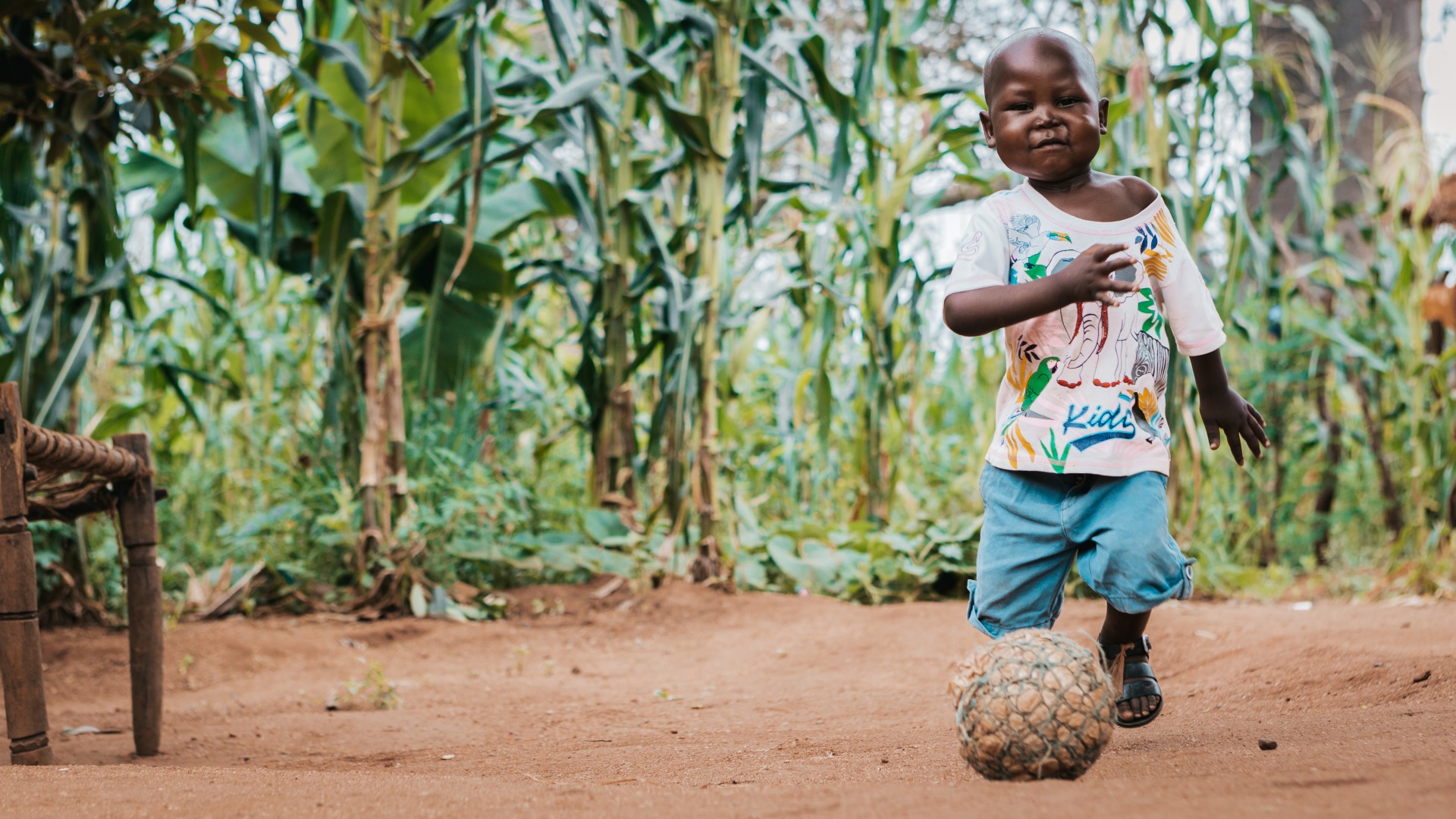 Rodrick, 4, plays with a ball at his grandparents' home.