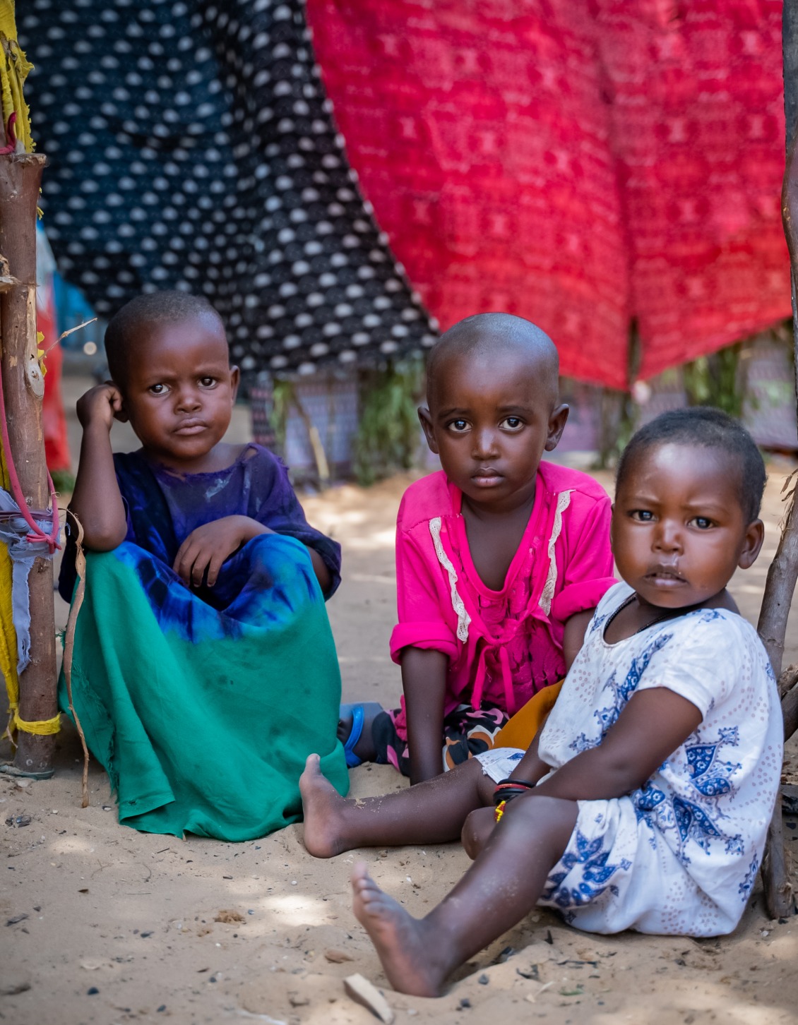 Three young girls in a displacement camp near Mogadishu. More than one million people have fled their homes due to the drought.