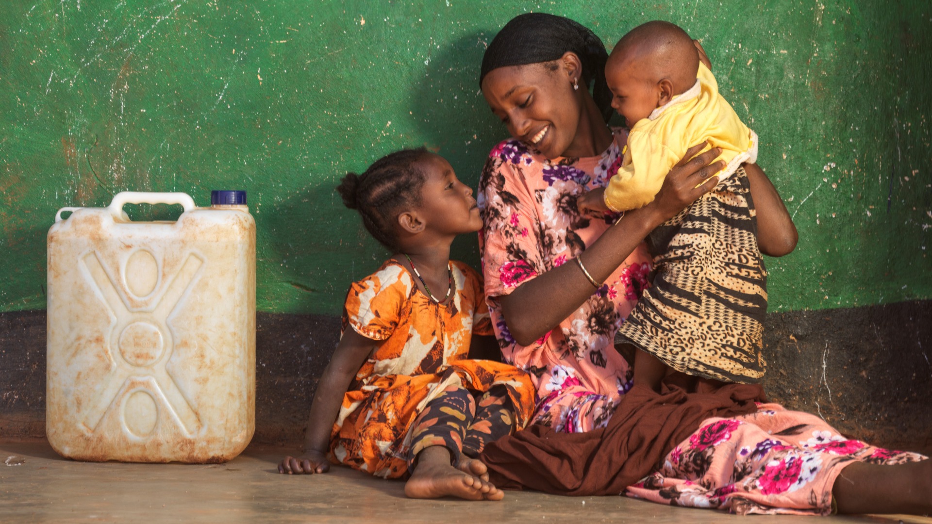 Darmi, 23, with daughters Lelo, 4, and Nadi, 1, at home in Moyale.