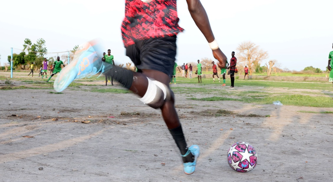 A free kick is taken by Thok Chak.