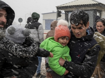Ukrainian refugees face winter weather as they cross the border into Moldova.