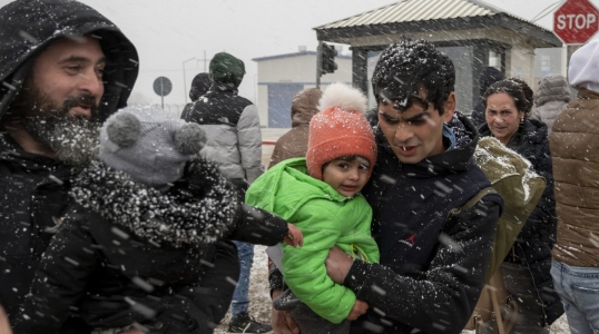 Ukrainian refugees face winter weather as they cross the border into Moldova.