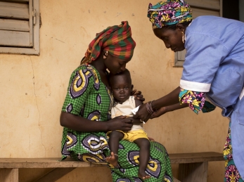 Naré Tounkara, matron of the Boudofo Community Health Center in Kita, Mali, measures a child for malnutrition.